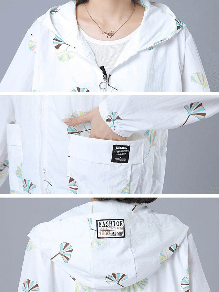 Women's floral print hooded jacket with zipper, pockets, and windbreaker design in white.
